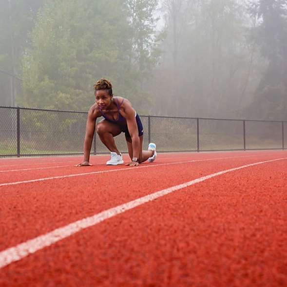 Betty at the start line of a running track